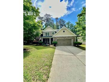Charming two-story home with stone accents, landscaped yard, and a long driveway at 4832 Batiste Nw Ln, Acworth, GA 30101