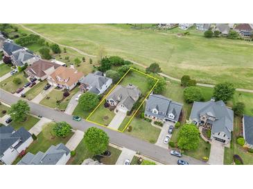 Aerial view of the property showing the house, backyard, and surrounding neighborhood at 5375 Glenhaven Dr, Cumming, GA 30041