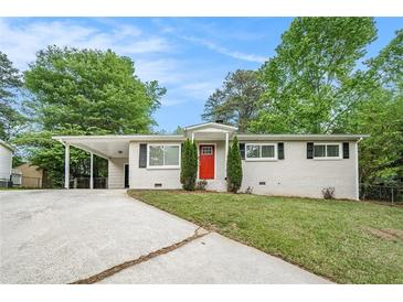 Charming single-story home with red front door, covered parking and fresh landscaping at 4004 Knightsbridge Nw Rd, Kennesaw, GA 30144