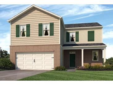 Charming two-story home with a two-car garage, green shutters, and well-maintained landscaping at 8197 Bluewater Dr, Fairburn, GA 30213