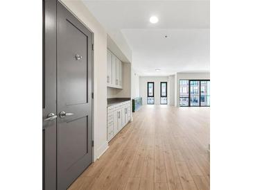 Bright, open living space with hardwood floors, custom built-ins and large windows at 1100 Howell Mill Nw Rd # 505, Atlanta, GA 30318