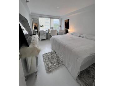 Bright bedroom featuring white walls and modern furnishings and natural light at 2479 Peachtree Rd # 503, Atlanta, GA 30305