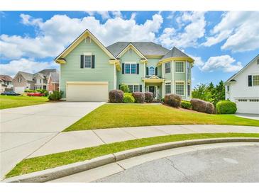 Charming two-story home with a well-manicured lawn, attached garage and inviting curb appeal at 2727 Lost Mill Trce, Buford, GA 30519