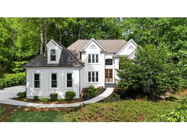 Inviting traditional two-story home with manicured lawn and detailed architectural design at 1358 Peppergrass Nw Trl, Acworth, GA 30101