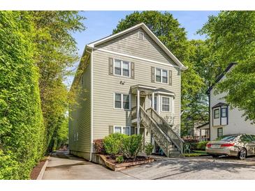 Charming two-story home with neutral siding, complemented by well-manicured landscaping and a spacious driveway at 1738 Taylor Nw St # B2, Atlanta, GA 30318