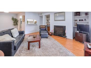 Inviting living room with hardwood floors, fireplace, and comfortable seating at 1418 Summit North Ne Dr # 1418, Atlanta, GA 30324