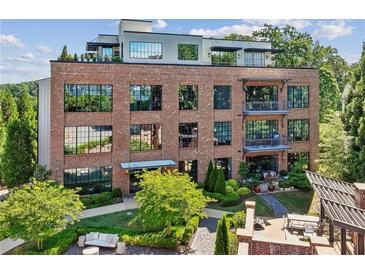 Stunning brick building with modern architecture, landscaping and outdoor seating offers luxurious urban living at 214 Vickery Falls Dr, Roswell, GA 30075