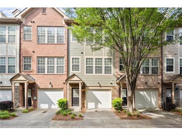 Charming townhome with attached garage and manicured landscaping at 3708 Ashford Creek Ne Hl # 3708, Atlanta, GA 30319