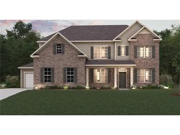 Charming brick two-story home with neutral shutters, columns, and well-manicured lawn at 731 Hedwig Dr, Mcdonough, GA 30252