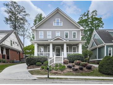 Charming two-story home featuring a welcoming front porch and beautifully landscaped front yard at 1110 Parkview Se Pl, Smyrna, GA 30080