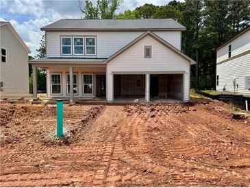 Charming two-story home with a two-car garage and covered porch, ready to be personalized at 2076 Boxwood Circle Se, Conyers, GA 30094
