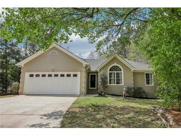 Charming single-story home with a two-car garage and well-maintained lawn at 2410 Bankstone Sw Dr, Marietta, GA 30064