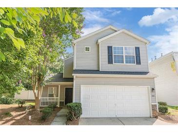 Charming two-story home with a two-car garage and well-manicured landscaping in a desirable neighborhood at 606 Windcroft Nw Cir, Acworth, GA 30101