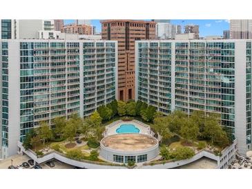 Stunning aerial view of the condo complex with pool, clubhouse, and lush landscaping, perfect for luxurious living at 44 Peachtree Ne Pl # 1929, Atlanta, GA 30309