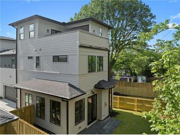 Beautiful three-story home with a well-maintained yard and modern siding at 88 Cleveland Unit B Se St, Atlanta, GA 30316