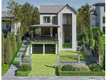 Stunning modern home features a landscaped front yard, two-car garage, and an elegant glass-enclosed entryway at 777 Brookridge Ne Dr, Atlanta, GA 30306