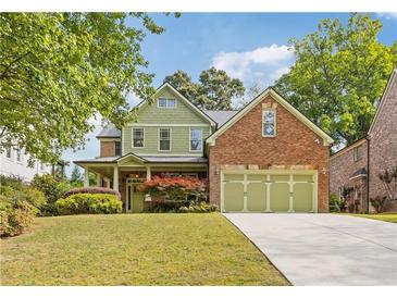 Charming two-story home with a well-manicured lawn and a three-car garage at 2853 N Thompson Ne Rd, Brookhaven, GA 30319