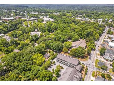 Expansive aerial view showcases property within a lush, green neighborhood and close to the downtown community at 963 Forrest St, Roswell, GA 30075