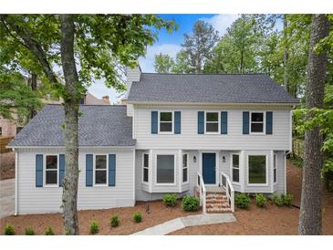 Charming two-story home featuring blue shutters and a well-maintained front yard at 3070 Branford Ct, Marietta, GA 30062