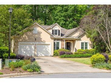 Charming single-Gathering home boasts a two-car garage and manicured landscaping at 2825 Harbor Cove Ct, Cumming, GA 30041
