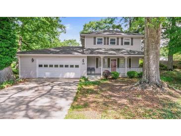 Charming two-story home with a two-car garage, covered porch, and well-maintained landscaping at 15 Ashton Pl, Covington, GA 30016