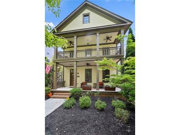 Charming two-story home featuring a double porch, landscaped yard and a classic design at 5160 Pratt Sw St, Covington, GA 30014