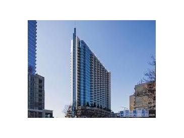 Modern high-rise building with sleek architecture and a view of the surrounding cityscape at 860 Peachtree Ne St # 909, Atlanta, GA 30308