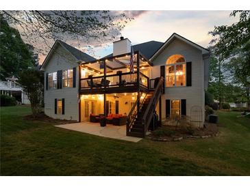 Inviting backyard featuring a spacious patio and deck, perfect for outdoor entertaining at 9889 Between The Grns, Villa Rica, GA 30180