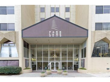 Building entrance with a modern glass facade and the name of the building above the entrance at 2479 Peachtree Rd # 601, Atlanta, GA 30305