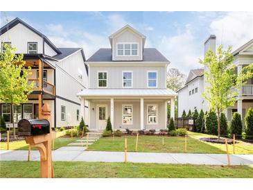 Attractive two-story home with a well-manicured lawn and inviting front porch at 2761 Mathews St, Smyrna, GA 30080