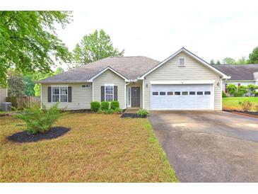 Charming single-story home with a manicured front yard, two car garage, and cozy curb appeal at 604 Lexington Way, Woodstock, GA 30189