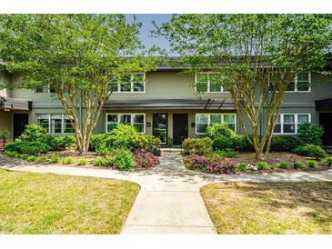 Charming townhome featuring well-maintained landscaping and a welcoming walkway at 331 Lakemoore Ne Dr # C, Atlanta, GA 30342