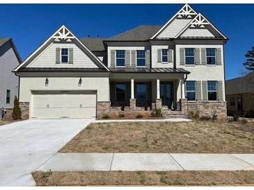 Charming two-story home featuring a two-car garage and beautifully landscaped front yard at 739 Marlay Sw Ln, Powder Springs, GA 30127