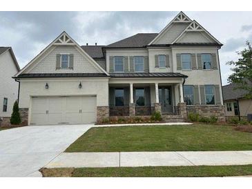 Beautiful two-story home with a two-car garage and well-manicured lawn at 739 Marlay Sw Ln, Powder Springs, GA 30127