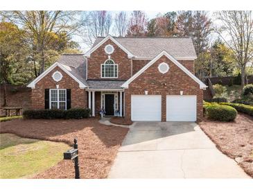Charming two-story brick home featuring a two-car garage and well-maintained landscaping at 2269 Howell Farms Nw Trl, Acworth, GA 30101