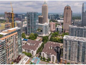 Incredible aerial view of the building and the city skyline at 1075 Peachtree Ne Walk # A204, Atlanta, GA 30309