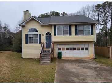 Charming two-story home featuring a two car garage and traditional architectural details at 1119 Oakwood Manor Ct, Decatur, GA 30032