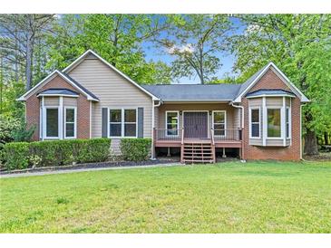 Charming ranch-style home with a well-maintained lawn and inviting front porch at 4805 Forest Way Ct, Marietta, GA 30066