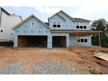 New construction showing a two-story home with an attached two-car garage at 214 Wild Ginger Bnd, Woodstock, GA 30188