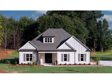 Charming white farmhouse with a gray roof and shutters, complemented by a lush green lawn at 140 Paislee Park (Lot #5 Paislee Park) Dr, Fayetteville, GA 30215