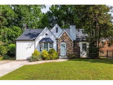 Charming home with stone accents and a well-manicured lawn, offering great curb appeal and a welcoming entrance at 1334 Milton Se Pl, Atlanta, GA 30316