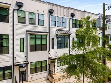 Charming townhome exterior showcasing modern architecture and multiple windows for ample natural light at 1265 Wright Se Ln, Atlanta, GA 30316