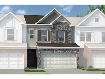 Charming townhome featuring stone accents, a two-car garage, and a welcoming facade at 210 Bastian Dr # 109, Villa Rica, GA 30180