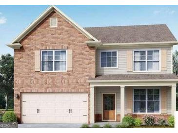 Charming two-story home featuring a brick facade, attached garage, and inviting front porch at 2081 Orchird Ln, Lithia Springs, GA 30122