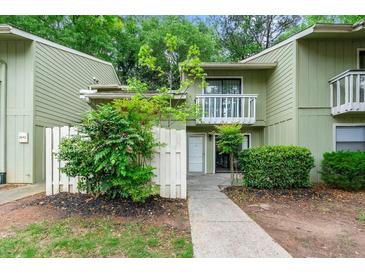 Inviting townhouse with a charming balcony, well-maintained landscaping, and a freshly painted exterior at 2638 Stoney Creek Rd, Marietta, GA 30067