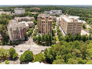 Stunning aerial view of luxurious high-rise buildings surrounded by lush greenery in a vibrant urban setting at 3286 Northside Nw Pkwy # 903, Atlanta, GA 30327