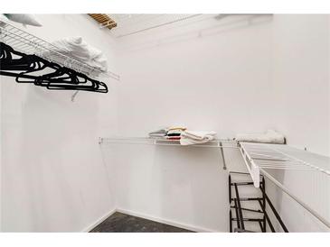 A spacious walk-in closet with wire shelving perfect for organizing clothes and linens at 130 Arizona Ne Ave # 104, Atlanta, GA 30307