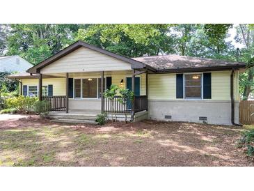 Charming single-story home with a welcoming front porch and well-maintained landscaping at 2981 Judylyn Dr, Decatur, GA 30033