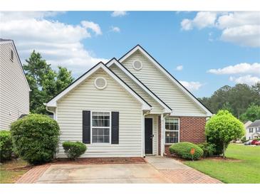 Charming single-story home with brick and siding, featuring a well-manicured lawn and inviting curb appeal at 220 Turnstone Rd, Stockbridge, GA 30281