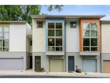 Modern townhome complex with large windows and colorful facade at 1346 Peter Haughton Nw Way, Atlanta, GA 30318